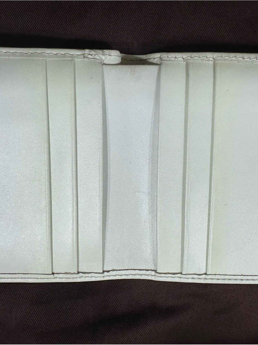 COACH White Leather Fold Wallet with Signature Metal Accent